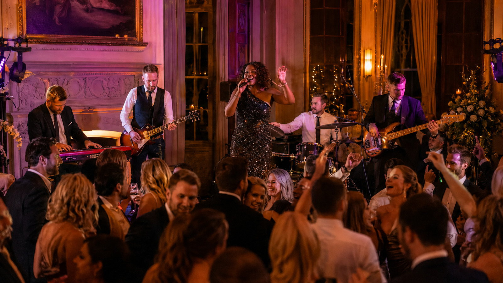 Live wedding band performing to a dancing crowd